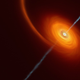 An illustration of a black hole surrounded by superheated material and spewing relativistic jets.